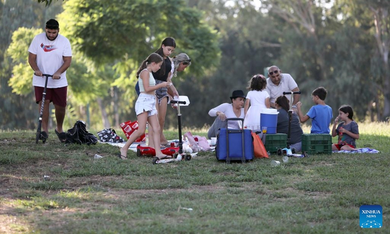 People enjoy themselves at Hayarkon Park during the Sukkot holiday in Tel Aviv, Israel, Oct. 11, 2022.(Photo: Xinhua)