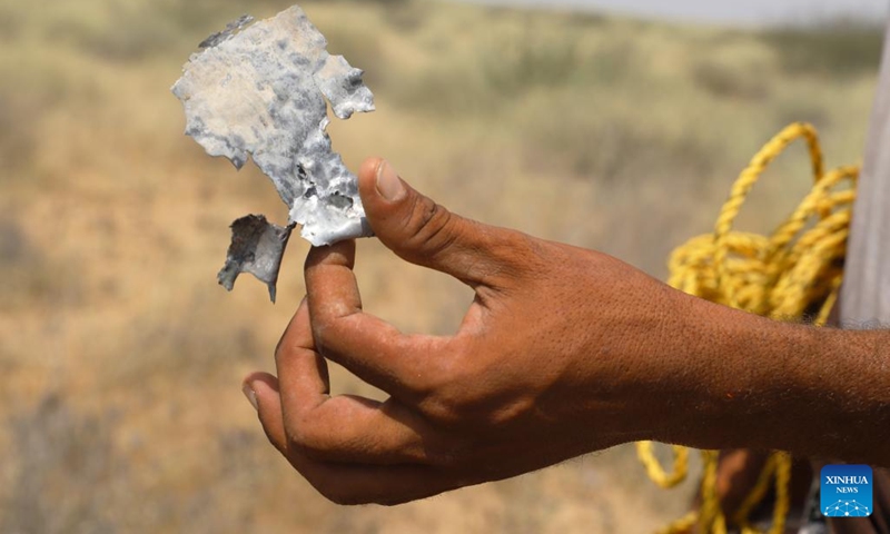 A farmer holds a piece of shrapnel from an exploded landmine in the Abs district, Hajjah Province, northern Yemen, on Oct. 7, 2022.(Photo: Xinhua)