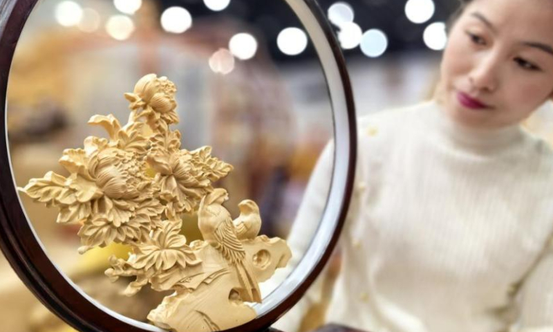 A wood carving artifact is displayed at an exhibition hall in Heze, east China's Shandong Province. Photo: China News Service