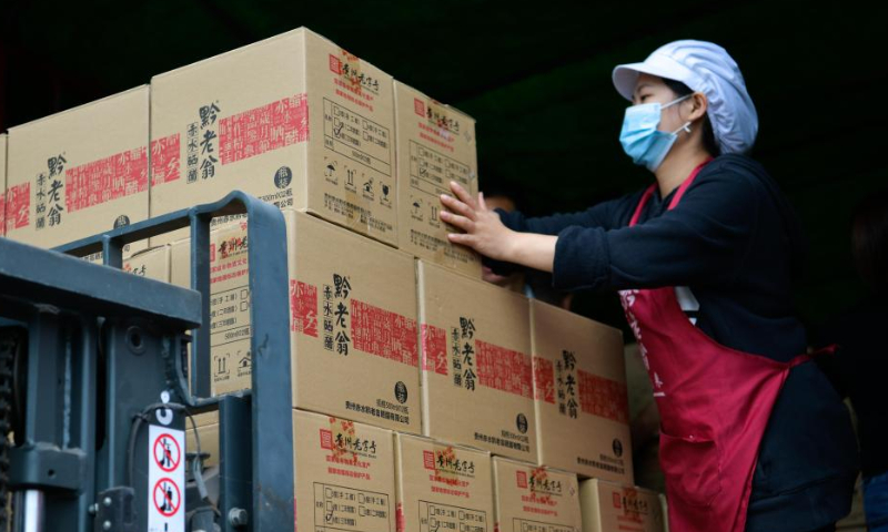 A worker moves bottled vinegar at a vinegar factory in Chishui, southwest China's Guizhou Province, Oct. 28, 2022. Photo: Xinhua