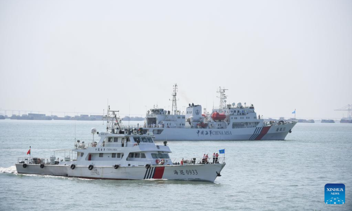 Rescue vessels and a helicopter take part in a maritime search and rescue drill in the Pearl River estuary, south China's Guangdong Province, on Oct 27, 2022. Photo:Xinhua