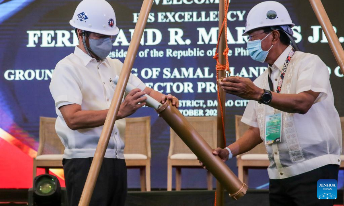 Philippine President Ferdinand Romualdez Marcos (L) leads the lowering of a time capsule during the groundbreaking ceremony of the China-funded Samal Island-Davao City Connector Bridge, in Davao City, the Philippines, Oct 27, 2022. Photo:Xinhua