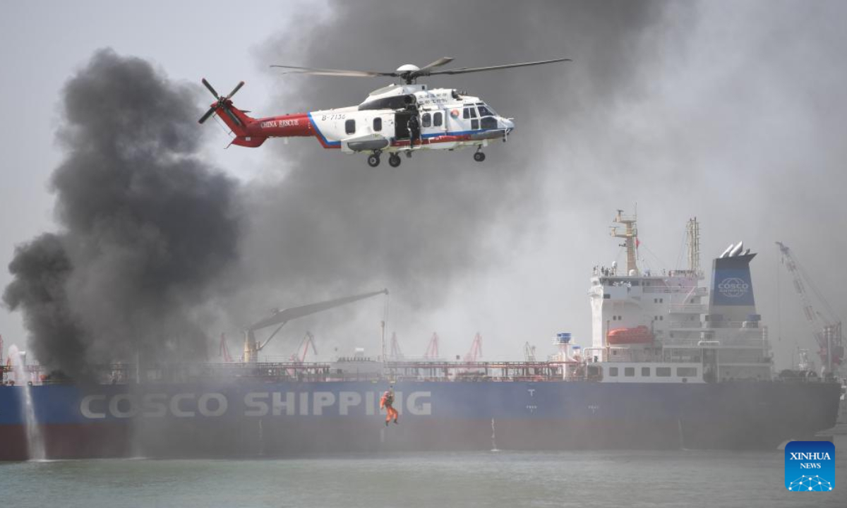 A helicopter practises saving people during a maritime search and rescue drill in the Pearl River estuary, south China's Guangdong Province, on Oct 27, 2022. Photo:Xinhua