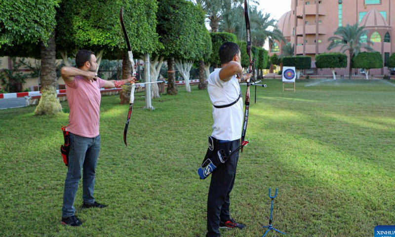 Palestinian Ahmed al-Zahhar (R) and Wasim Naief, practice archery in Gaza City, Oct. 17, 2022. Armed with the bows that they have handmade themselves, Ahmed al-Zahhar and Wasim Naief, two Gaza-based young Palestinians, aspire to enter the archery competition at the 2024 Olympic Games. Photo: Xinhua