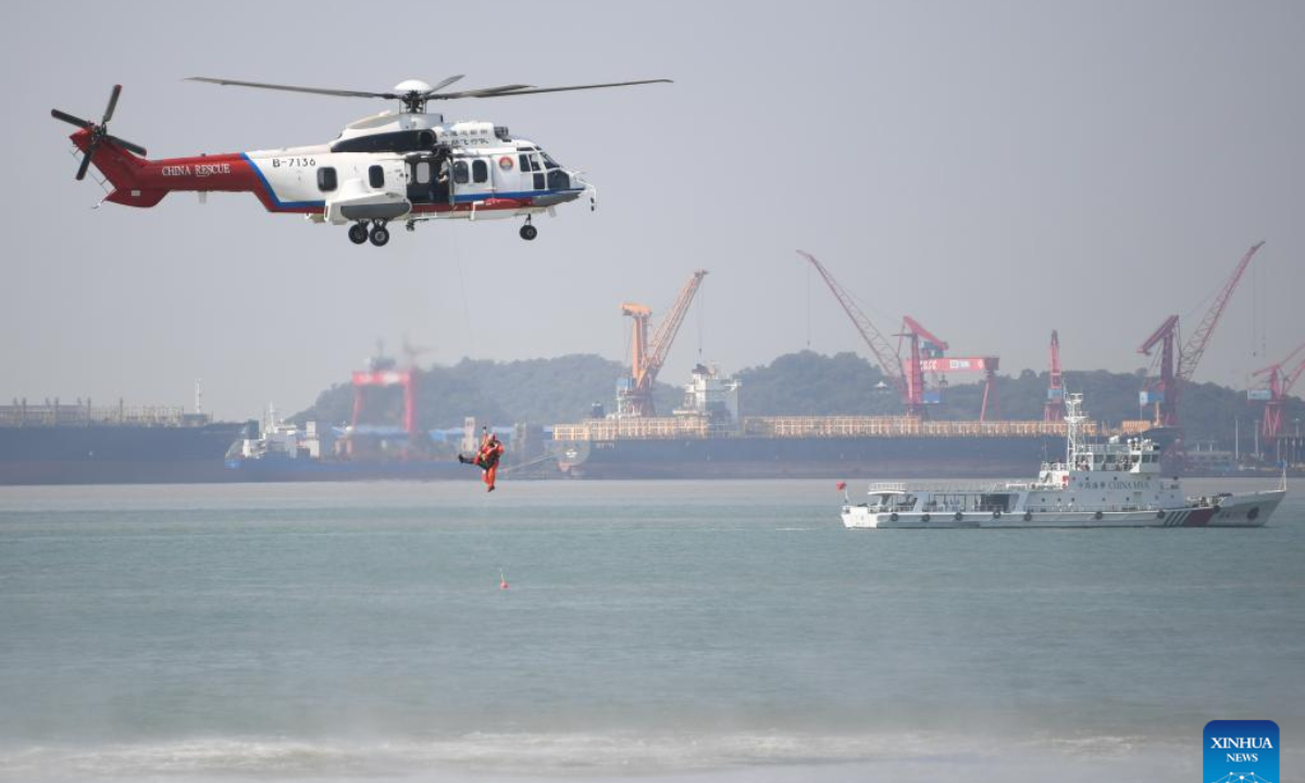 A helicopter practises saving a person during a maritime search and rescue drill in the Pearl River estuary, south China's Guangdong Province, on Oct 27, 2022. Photo:Xinhua