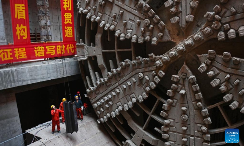 This photo taken on Oct. 24, 2022 shows the shield tunneling machine Fuchun at the construction site of Qinwang tunnel project in Fuyang District of Hangzhou, east China's Zhejiang Province. Qinwang tunnel, the first river-crossing tunnel in Fuchun River Basin, was successfully drilled through on Monday. It is currently the largest shield tunnel in Zhejiang Province and the largest road-rail joint construction tunnel in China.(Photo: Xinhua)