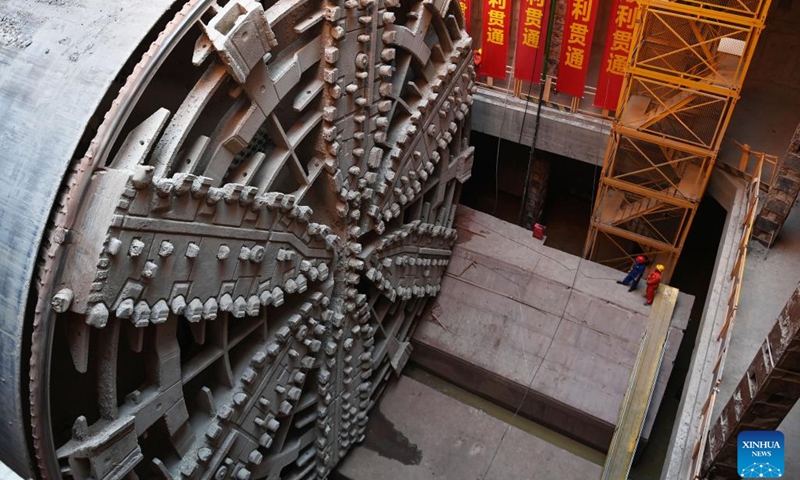 This photo taken on Oct. 24, 2022 shows the shield tunneling machine Fuchun at the construction site of Qinwang tunnel project in Fuyang District of Hangzhou, east China's Zhejiang Province. Qinwang tunnel, the first river-crossing tunnel in Fuchun River Basin, was successfully drilled through on Monday. It is currently the largest shield tunnel in Zhejiang Province and the largest road-rail joint construction tunnel in China. (Photo: Xinhua)