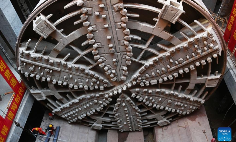 This photo taken on Oct. 24, 2022 shows the shield tunneling machine Fuchun at the construction site of Qinwang tunnel project in Fuyang District of Hangzhou, east China's Zhejiang Province. Qinwang tunnel, the first river-crossing tunnel in Fuchun River Basin, was successfully drilled through on Monday. It is currently the largest shield tunnel in Zhejiang Province and the largest road-rail joint construction tunnel in China. (Photo: Xinhua)