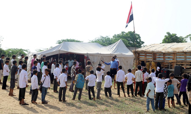 Students do morning exercise at a school that only has makeshift classrooms in Hajjah province, northern Yemen, on Oct. 23, 2022.(Photo: Xinhua)