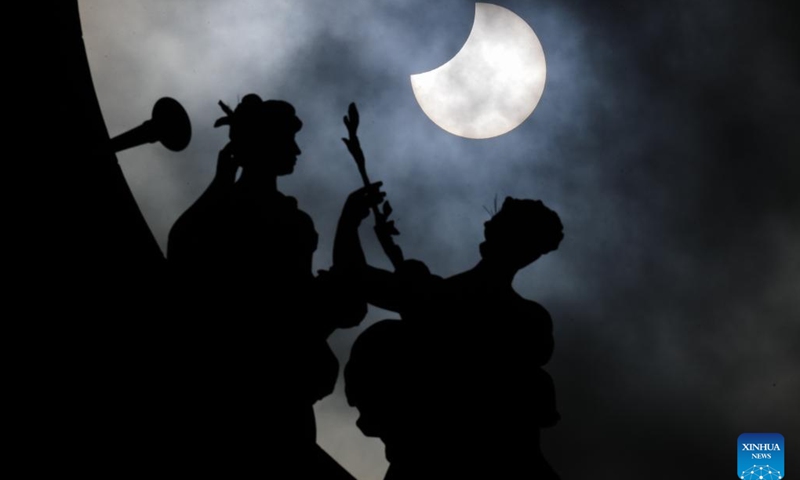 A partial solar eclipse is pictured at the Park of the Fiftieth Anniversary in Brussels, Belgium, Oct. 25, 2022.(Photo: Xinhua)