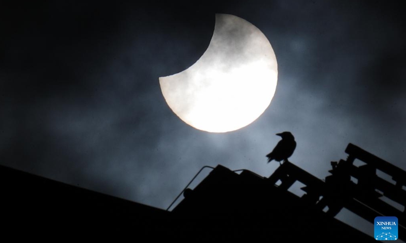 A partial solar eclipse is pictured at the Park of the Fiftieth Anniversary in Brussels, Belgium, Oct. 25, 2022.(Photo: Xinhua)