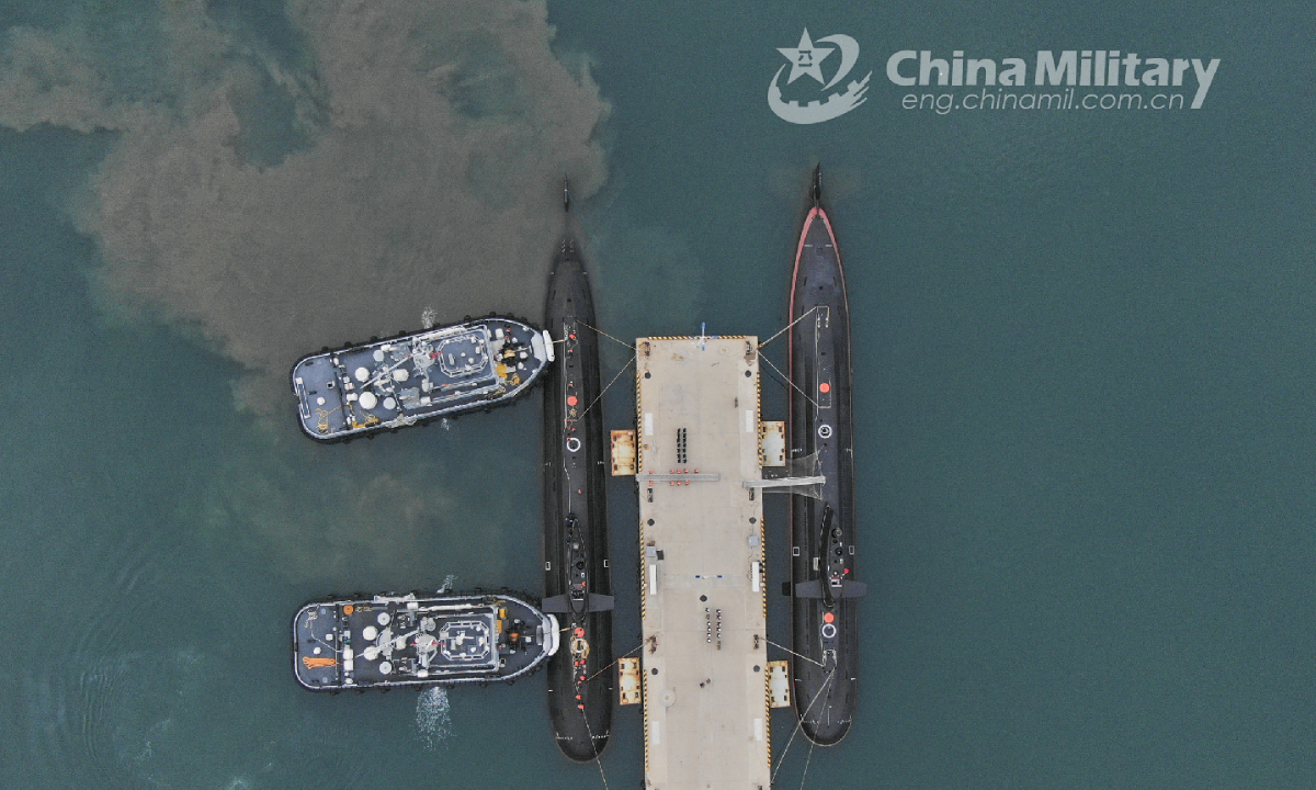 Two towboats attached to a submarine flotilla with the navy under the PLA Northern Theater Command jointly tow a submarine off a dock during a maritime drill on torpedo attack and defense, submarine control, etc. on October 25, 2022. Photo:China Military