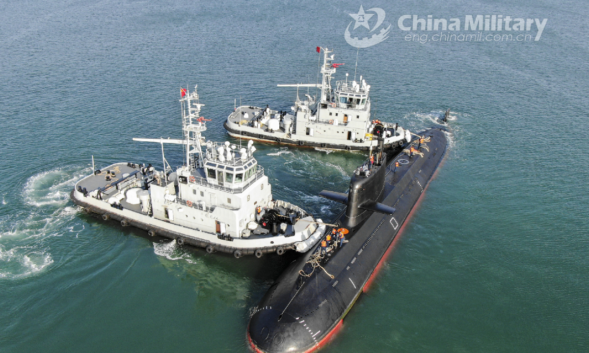 Two towboats attached to a submarine flotilla with the navy under the PLA Northern Theater Command jointly tow a submarine off a dock during a maritime drill on torpedo attack and defense, submarine control, etc. on October 25, 2022. Photo:China Military