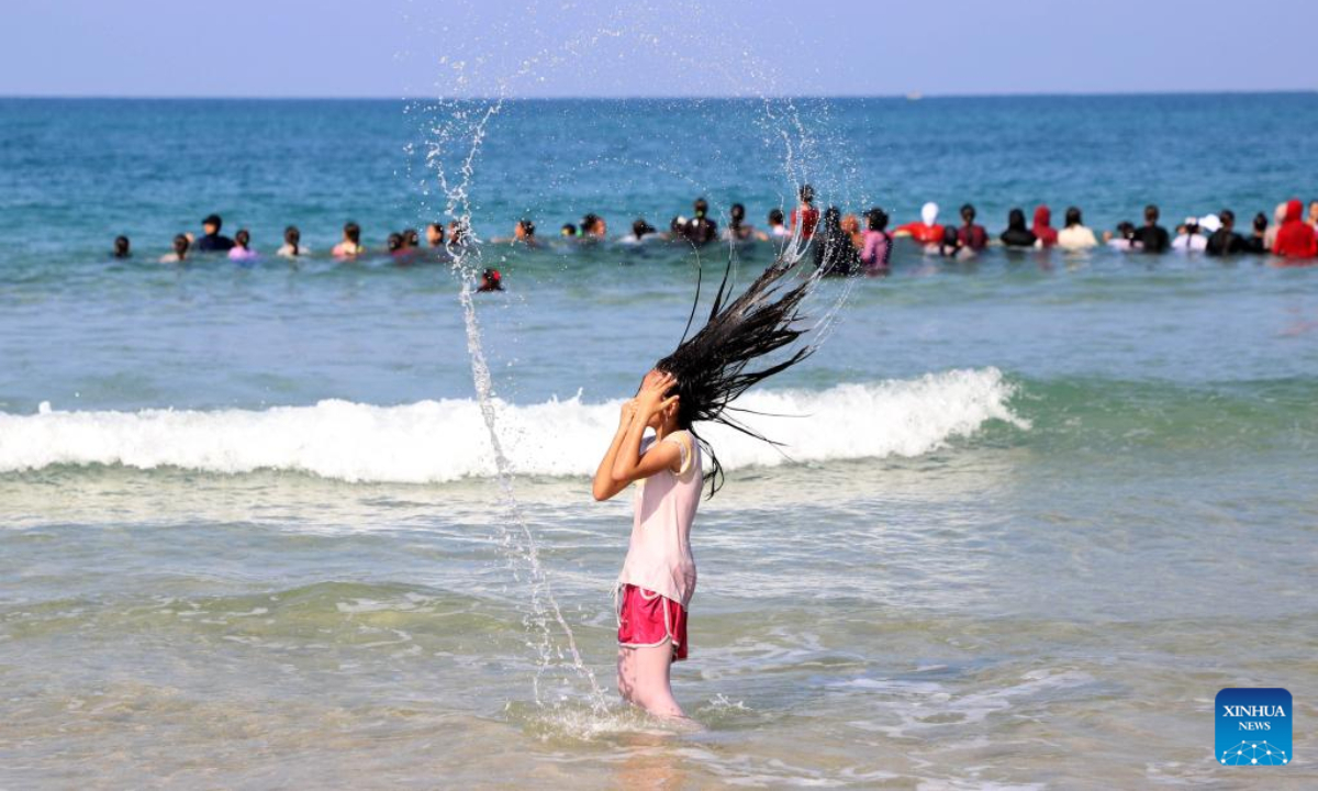 A Palestinian girl takes part in a swimming carnival in the Mediterranean Sea off Beit Lahia, northern Gaza Strip, on Nov 3, 2022. Photo:Xinhua