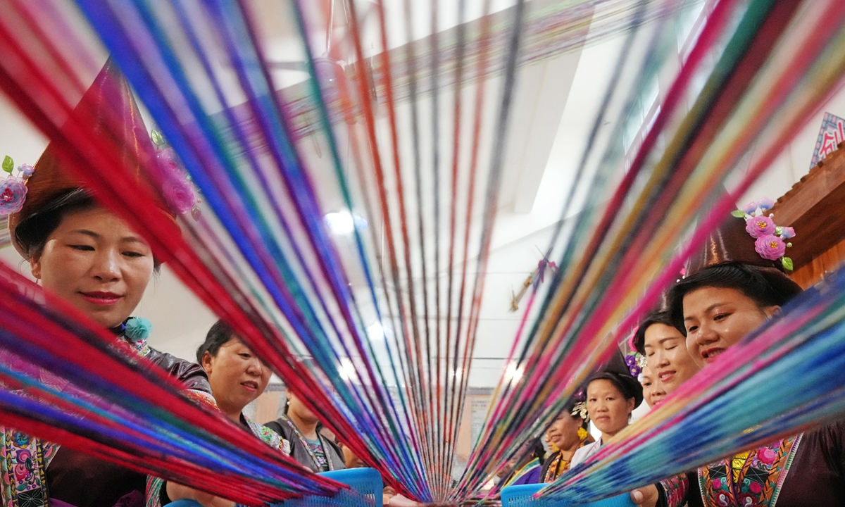 People learn traditional ethnic embroidery techniques in Rongshui Miao Autonomous County in Liuzhou city, South China's Guangxi Zhuang Autonomous on October 31, 2022. The Liuzhou authority held a three-day class on the age-old embroidery of the Miao ethnic group for local women. It's an item of intangible cultural heritage, and it also helps to provide incomes to local households. Photo: VCG