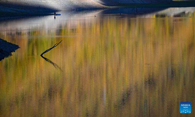 A person fishes at Debar Lake in North Macedonia, Oct. 30, 2022.(Photo: Xinhua)