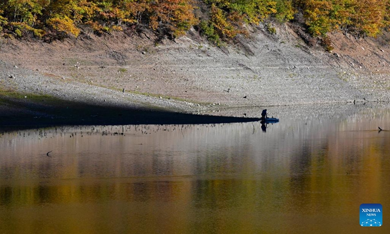 A person fishes at Debar Lake in North Macedonia, Oct. 30, 2022.(Photo: Xinhua)