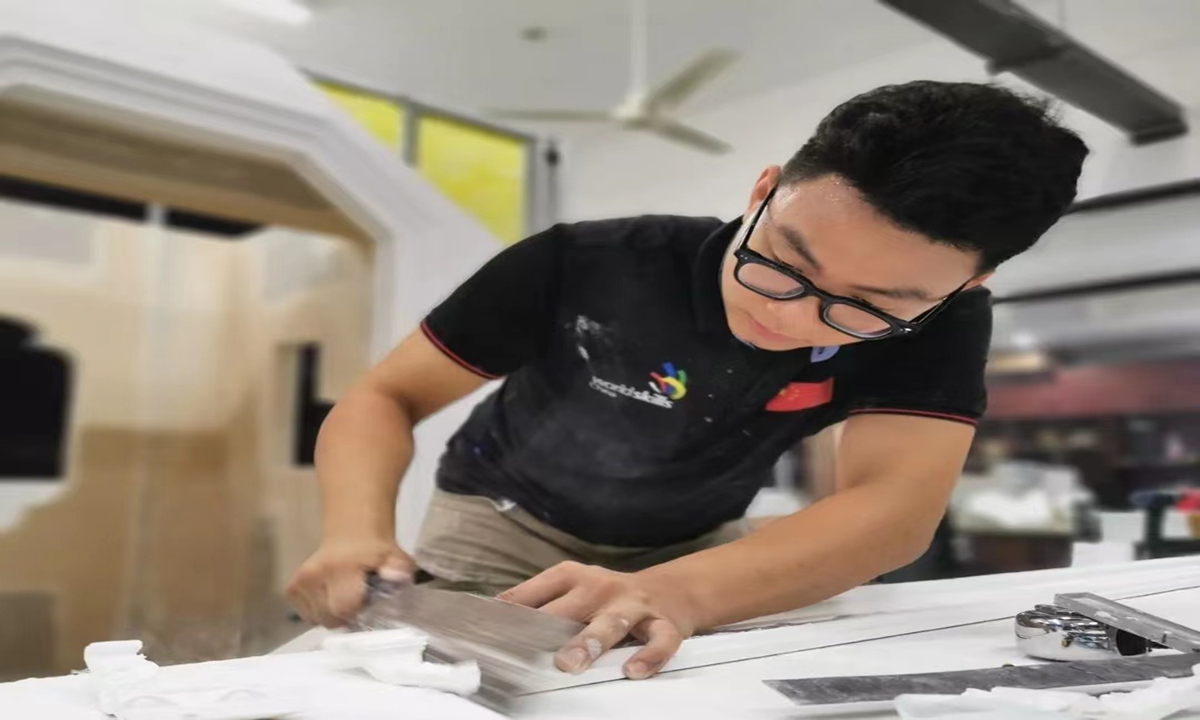 Ma Hongda, a student at Zhejiang Construction Technician College in Hangzhou, East China's Zhejiang Province, won the Plastering and Drywall Systems section of the WorldSkills Competition 2022 Special Edition with his excellent putty scraping skills. Photo: CCTV News