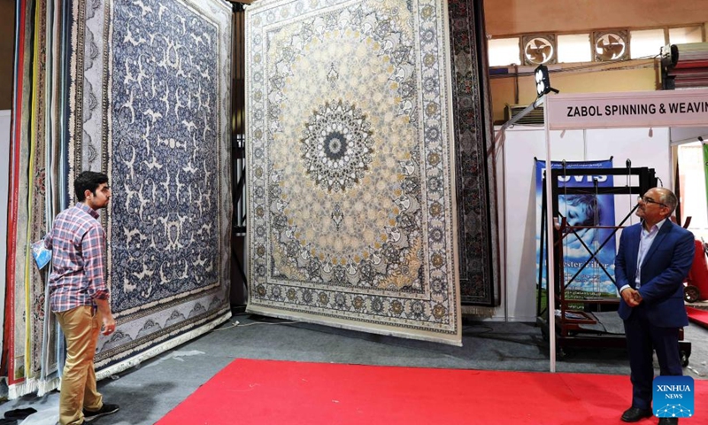 Iranian carpets are displayed during the 46th Baghdad International Fair in Baghdad, Iraq, on Nov. 1, 2022. Iraq on Tuesday opened the 46th Baghdad International Fair in the Iraqi capital of Baghdad after a three-year hiatus due to the COVID-19 pandemic.(Photo: Xinhua)