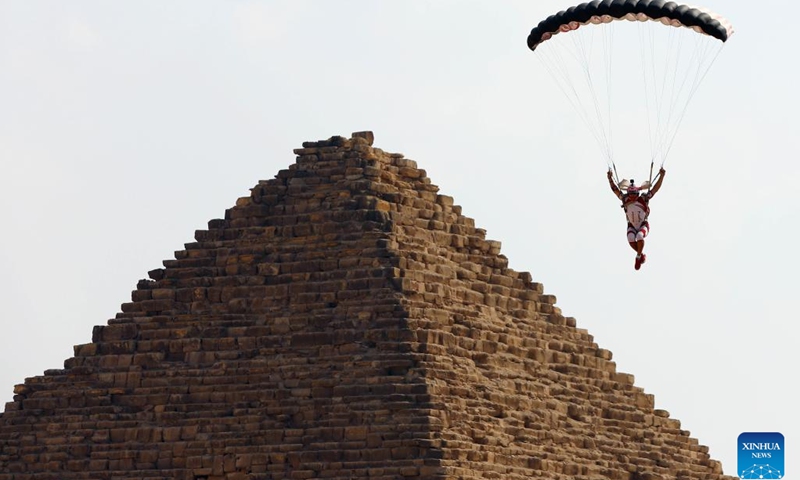 A skydiver flies by a pyramid during the skydiving festival Jump Like a Pharaoh in Giza, Egypt, on Nov. 2, 2022.(Photo: Xinhua)