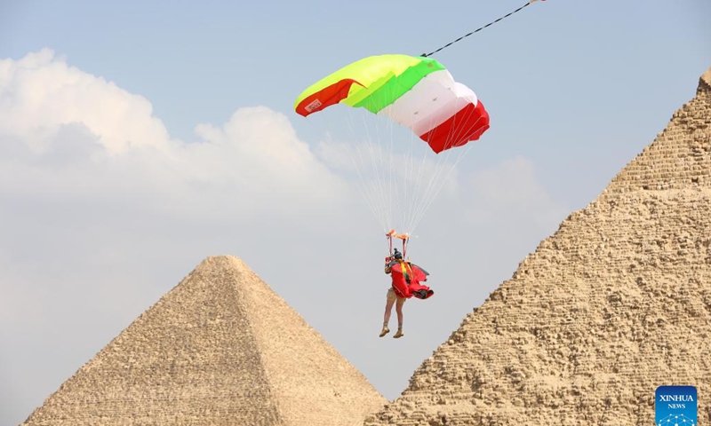 A skydiver flies by pyramids during the skydiving festival Jump Like a Pharaoh in Giza, Egypt, on Nov. 2, 2022.(Photo: Xinhua)