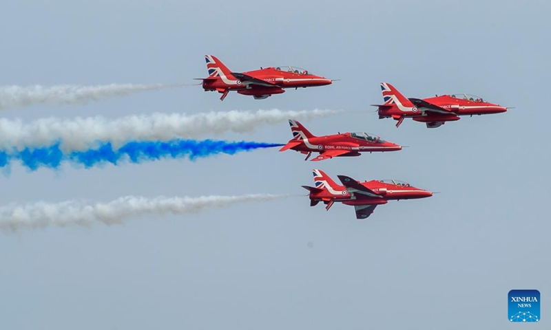 Airplanes from the Red Arrows of the Royal Air Force of Britain perform in Doha, Qatar, Nov. 5, 2022. (Photo by Nikku/Xinhua)