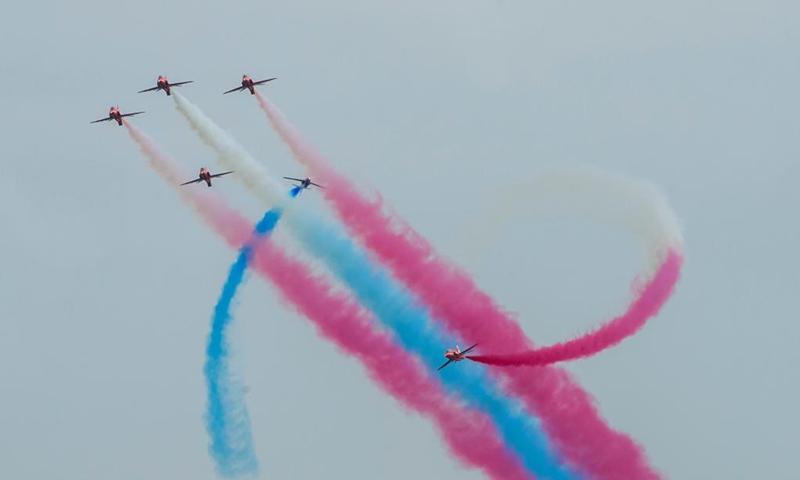 Airplanes from the Red Arrows of the Royal Air Force of Britain perform in Doha, Qatar, Nov. 5, 2022. (Photo by Nikku/Xinhua)