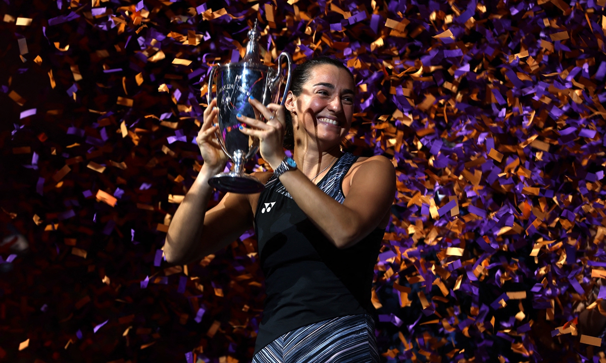 Caroline Garcia of France celebrates with the Billie Jean King Trophy at Dickies Arena in Fort Worth, Texas on November 7, 2022. Photo: AFP