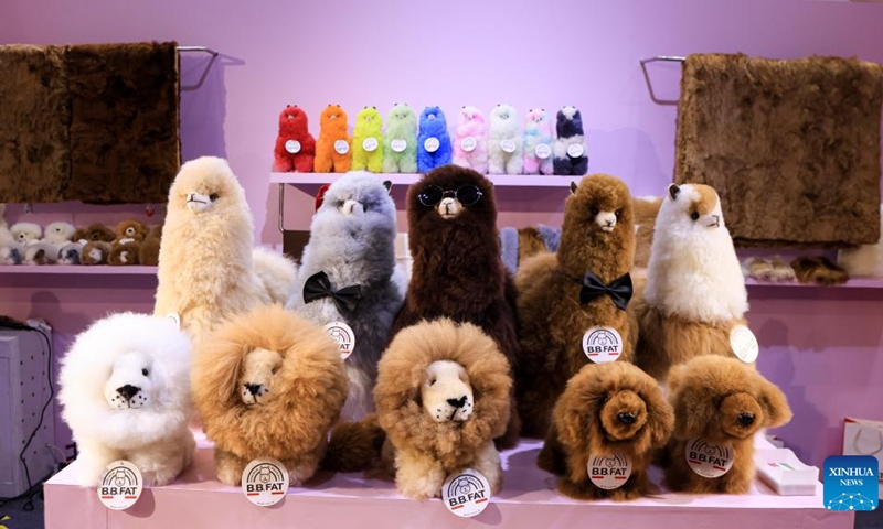 This photo taken on Nov. 6, 2022 shows alpaca toys displayed at a booth of a Peruvian company at the fifth China International Import Expo (CIIE) in east China's Shanghai. Exhibitors from Australia, New Zealand and Peru have displayed alpaca-fur products at the fifth CIIE in Shanghai, attracting many visitors.(Photo: Xinhua)