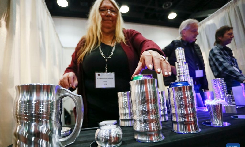 A vendor showcases aluminum-made cups at the Circle Craft Christmas Market in Vancouver, British Columbia, Canada, on Nov. 9, 2022.(Photo: Xinhua)