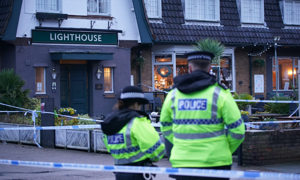 Police officers on duty at the Lighthouse Inn in Wallasey Village, near Liverpool, after a woman died and multiple people were injured in a shooting incident on Christmas Eve. The police said officers were called to the pub on December 24, 2022, following reports of gunshots. A young woman was taken to hospital with an injury consistent with a gunshot wound and later died. Photo: VCG