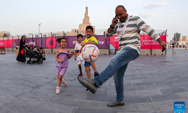 People play football at the Souq Waqif in Doha, Qatar, on Nov. 8, 2022. (Xinhua/Xu Zijian)