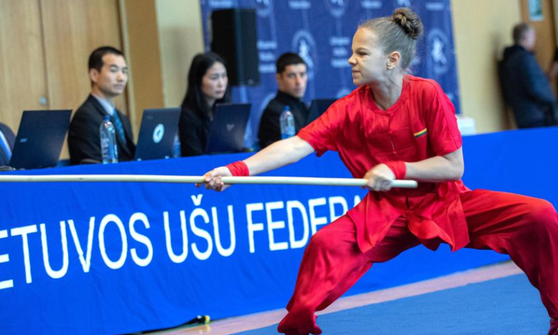 An athlete competes at the 8th Lithuanian Wushu (Kung Fu) Championship in Vilnius, Lithuania, on Dec. 10, 2022. The 8th Lithuanian Wushu (Kung Fu) Championship kicked off on Dec. 10, attracting nearly 100 competitors from Lithuania, Poland, Estonia, India and other countries to take part in. (Photo by Alfredas Pliadis/Xinhua)