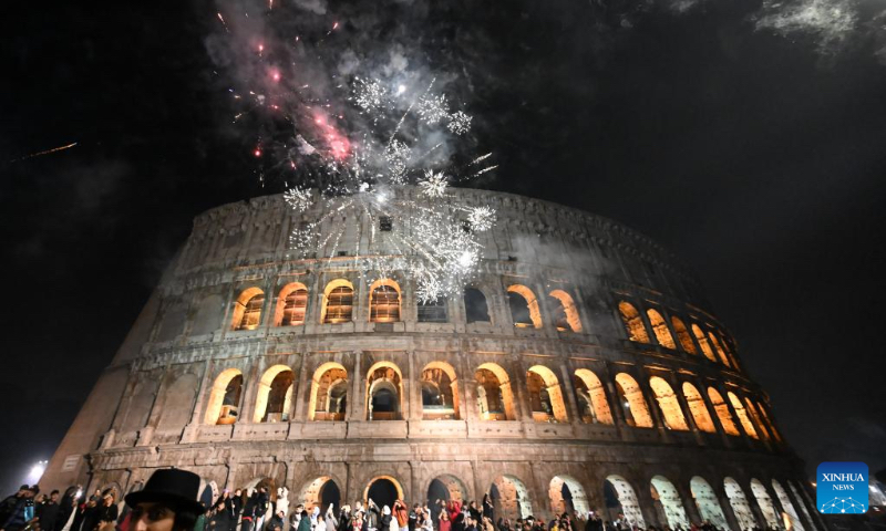 Fireworks explode near the Colosseo during the New Year celebrations in Rome, Italy, on Jan. 1, 2023. (Photo by Alberto Lingria/Xinhua)