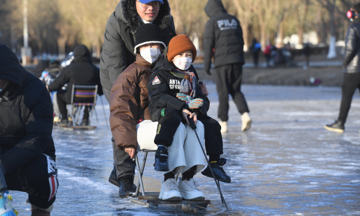 People play ice hockey and skate on the frozen Neihe River of Changbai Island in Shenyang, capital of Northeast China's Liaoning Province on December 10, 2022. Cold weather has turned lakes and rivers into natural ice rinks in Shenyang. Ice sports are popular among local residents. Photo: IC