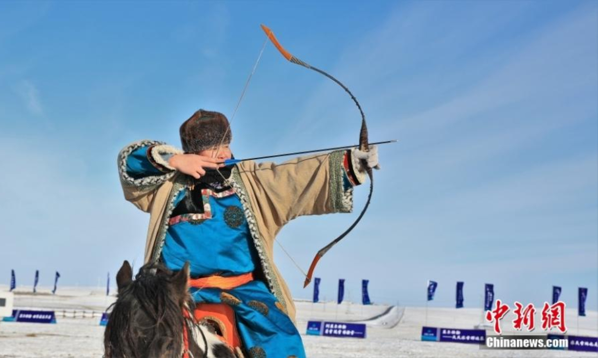 A herder takes part in an archery competition during the winter Naadam festival in Hulunbuir, north China's Inner Mongolia Autonomous Region , Dec 22, 2022. Photo:China News Service