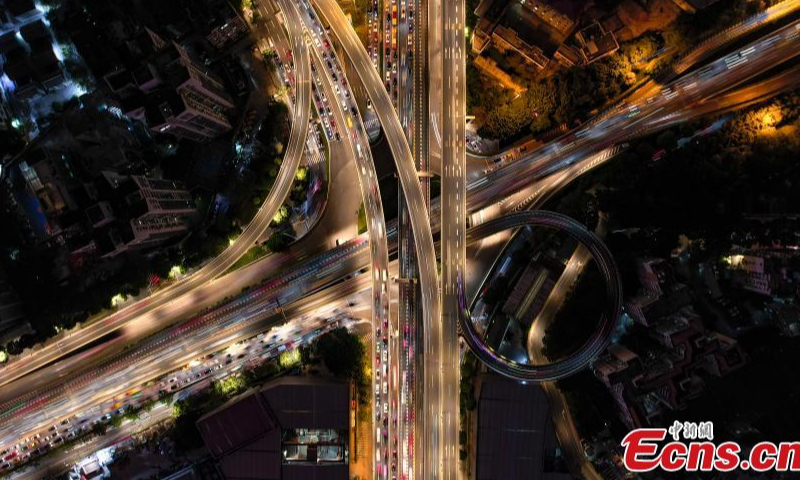 Drone photo shows aerial night view of an overpass bridge with car lights in Guangzhou, south China's Guangdong Province, Dec. 1, 2022. (Photo: China News Service/Chen Jimin)

More districts in Guangzhou have lifted temporary control measures to bring life and work back to normal amid the COVID-19 control.