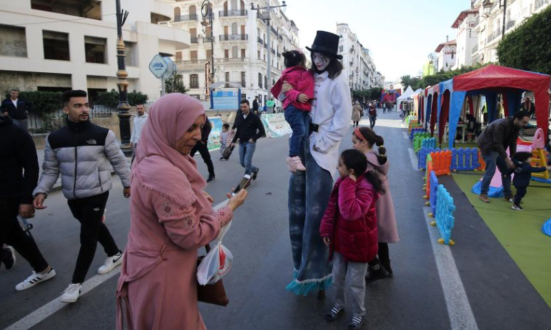 People take part in a car-free day event on a street in Algiers, Algeria, on Dec. 30, 2022. The car-free day event was held in downtown Algiers on Friday to raise public awareness about environment. Photo: Xinhua