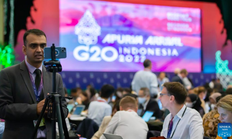 Journalists work at the media center for the 17th Group of 20 (G20) Summit in Bali, Indonesia, Nov. 15, 2022. The G20 summit kicked off here on Tuesday, with issues pertaining to world economic recovery, world health systems and climate change taking the center stage. Photo: Xinhua