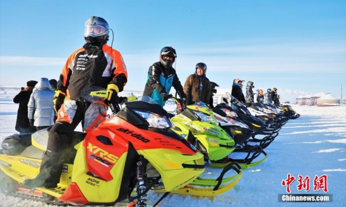 People take part in snow motorbike race during the winter Naadam festival in Hulunbuir, north China's Inner Mongolia Autonomous Region , Dec 22, 2022. Photo:China News Service