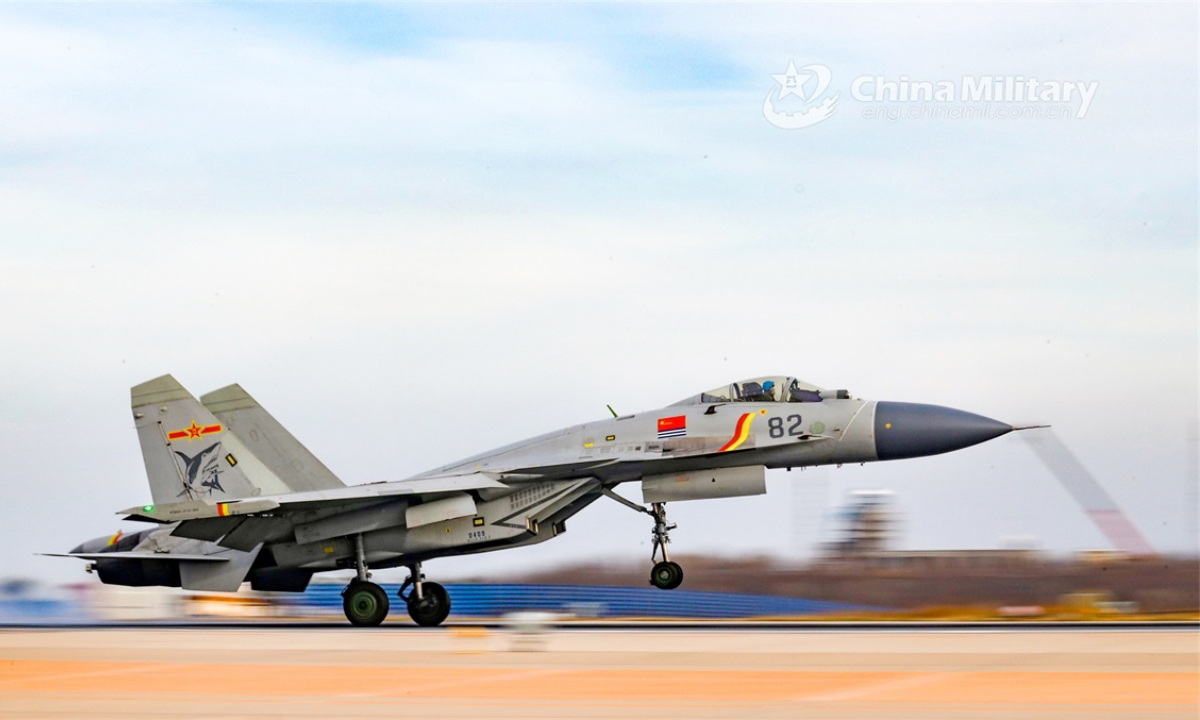 A carrier-based fighter jet attached to a regiment under the PLA Naval Aviation University lands on the runway during a real combat flight training exercise on November 16, 2022. (eng.chinamil.com.cn/Photo by Ni Shuai)