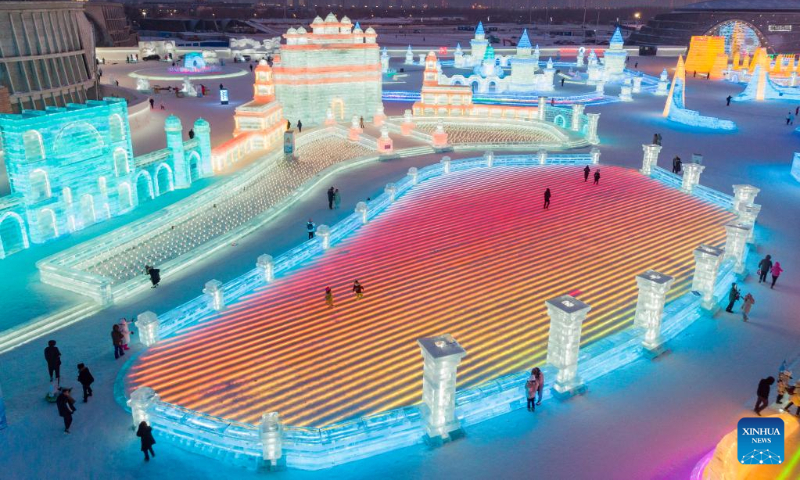 This aerial photo taken on Jan. 3, 2023 shows tourists visiting the Harbin Ice-Snow World in Harbin, northeast China's Heilongjiang Province. (Xinhua/Xie Jianfei)