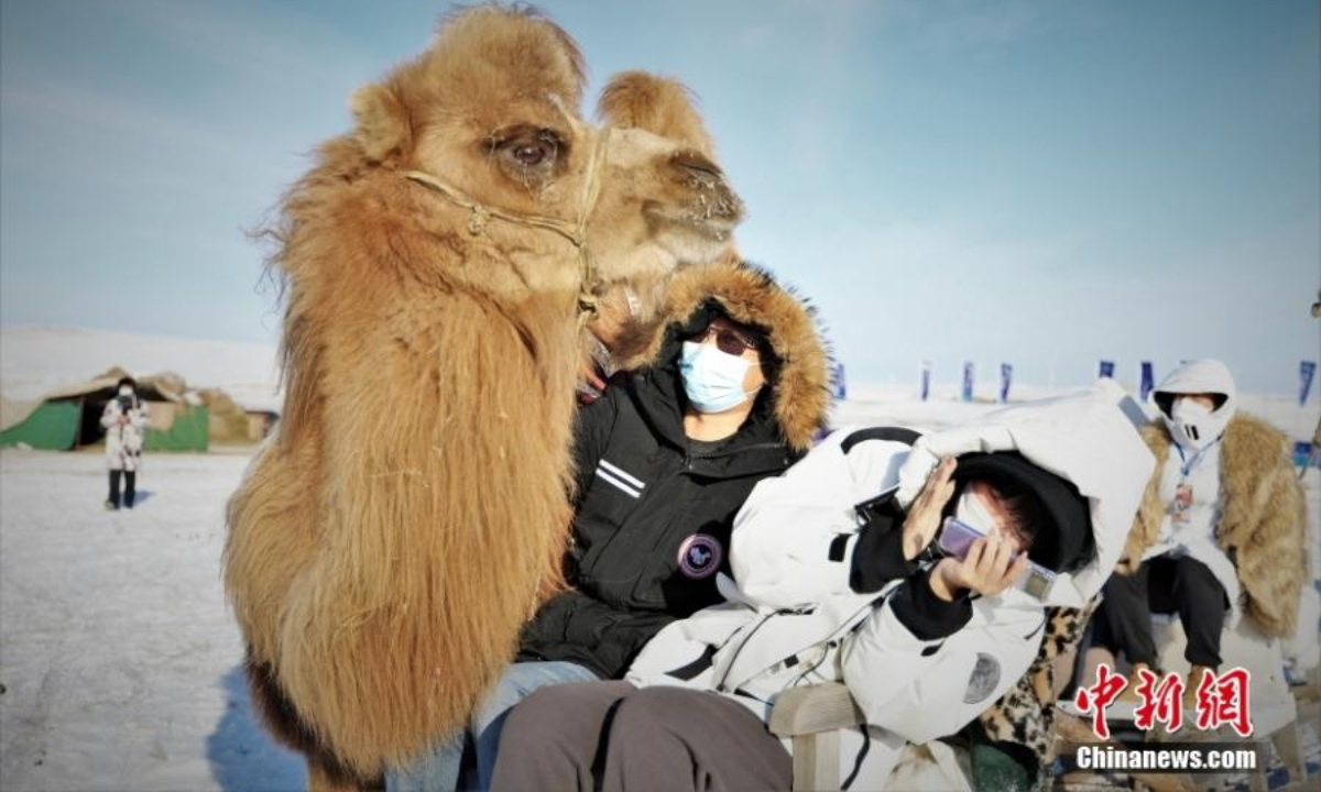 Tourists have fun during the winter Naadam festival in Hulunbuir, north China's Inner Mongolia Autonomous Region , Dec 22, 2022. Photo:China News Service