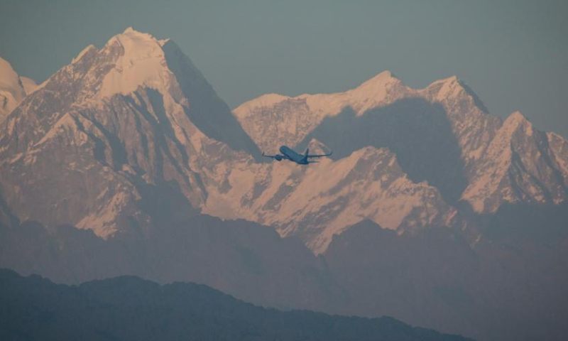 A mountain range is seen from the Kathmandu Valley during the sunset time on the occasion of the International Mountain Day in Lalitpur, Nepal, Dec. 11, 2022. (Photo by Hari Maharjan/Xinhua)