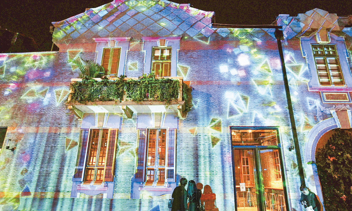 A dazzling light show is staged along the street wall of the West Zone of Zhang’s Garden, a famous scenic spot in Shanghai on November 27, 2022. Photo: IC