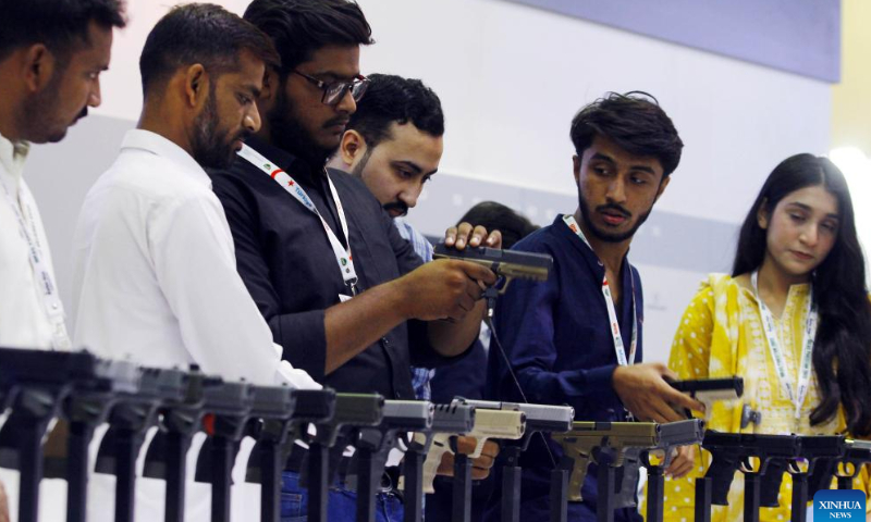 People visit the International Defense Exhibition and Seminar (IDEAS) in Karachi, Pakistan on Nov. 16, 2022. The 11th edition of IDEAS is held at the Karachi Expo Center in Pakistan's southern port city of Karachi. Photo: Xinhua