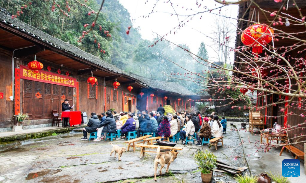 Villagers attend a shareholder meeting of the cooperatives in Chenjiapo Village of Yongshun County, central China's Hunan Province, Jan 29, 2022. Photo:Xinhua