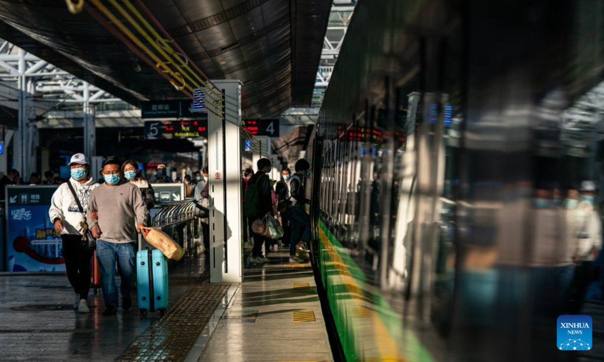 Passengers get on a train of the China-Laos Railway at Kunming Railway Station in Kunming, southwest China's Yunnan Province, Nov 23, 2022. Photo:Xinhua