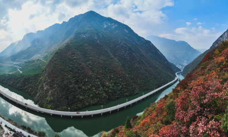 This aerial panoramic photo taken on Nov. 27, 2022 shows a road over water in Xingshan County of Yichang, central China's Hubei Province. (Photo by Zheng Jiayu/Xinhua)