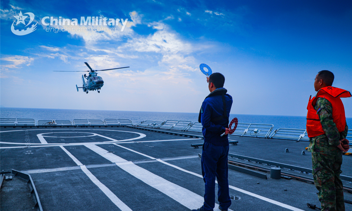 A ship-borne helicopter attached to a naval combat support flotilla under the PLA Southern Theater Command conducts takeoff and landing training during a maritime training exercise on September 28, 2022. Photo: China Military